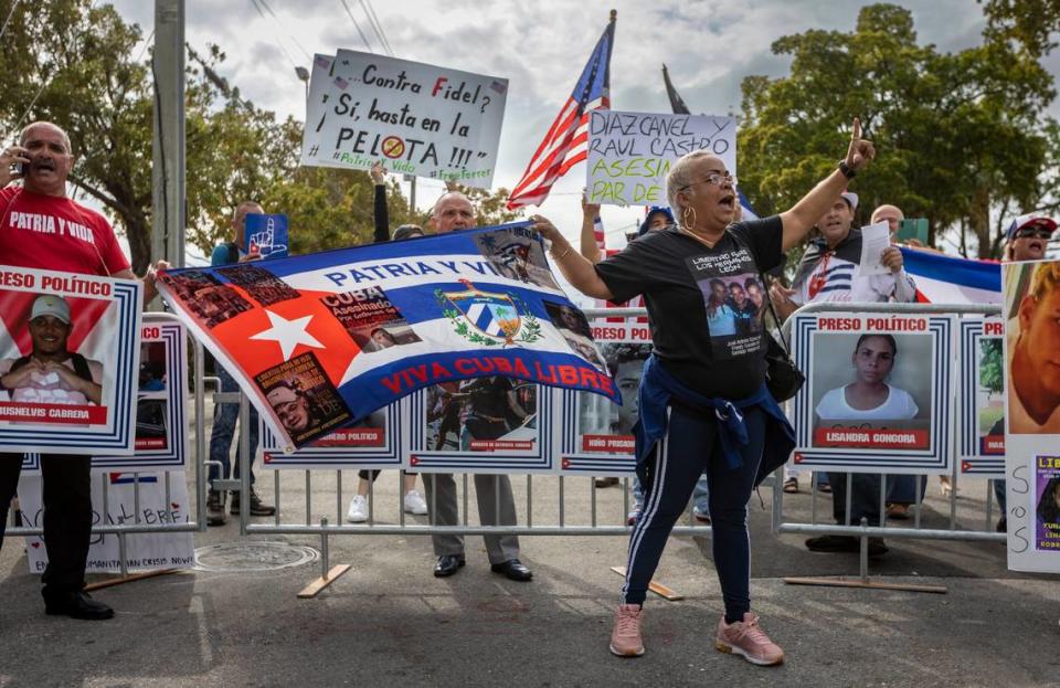 MIAMI, FL- March 19, 2023 - Protestors shout slogans in front of loanDepot Park prior to the baseball game between Cuba and the United States.