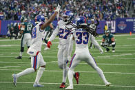 New York Giants' Aaron Robinson (33), right, celebrates with teammates after breaking up a play during the second half of an NFL football game against the Philadelphia Eagles, Sunday, Nov. 28, 2021, in East Rutherford, N.J. (AP Photo/Corey Sipkin)