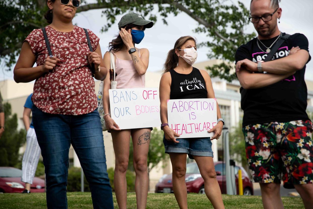 Abortion-rights advocates gather at Albert Johnson Park near City Hall in Las Cruces, N.M. to protest after a leaked draft opinion showed that the Supreme Court voted to strike down Roe v. Wade on Tuesday, May 3, 2022.