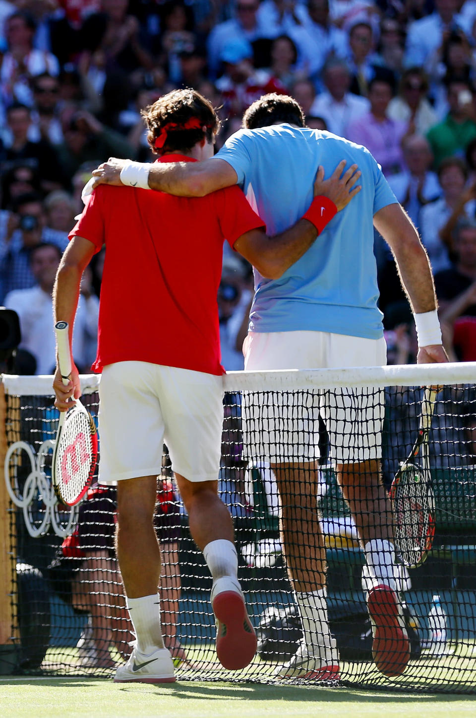 (L-R) Roger Federer of Switzerland is congratulated by Juan Martin Del Potro of Argentina after his 4-6, 7-6, 19-17 win in the Semifinal of Men's Singles Tennis on Day 7 of the London 2012 Olympic Games at Wimbledon on August 3, 2012 in London, England. (Photo by Clive Brunskill/Getty Images)