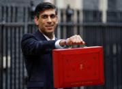 Britain's Chancellor of the Exchequer Rishi Sunak holds the budget box outside his office in Downing Street in London