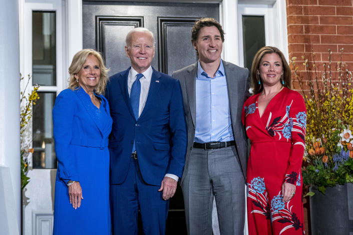 President Joe Biden and first lady Jill Biden pose for members of the media as they arrive to visit with Canadian Prime Minister Justin Trudeau and his wife Sophie Gregoire Trudeau at Rideau Cottage, Thursday, March 23, 2023, in Ottawa, Canada. (AP Photo/Andrew Harnik)