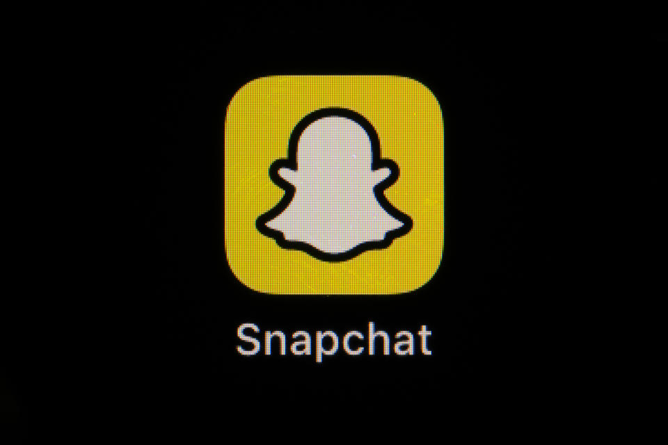 FILE - The icon for instant messaging app Snapchat is seen on a smartphone, Feb. 28, 2023, in Marple Township, Pa. The United States signed a memorandum with several of the world’s biggest social media companies on Thursday, July 11, 2024, including Snap, aimed at preventing the use of their platforms for the distribution of synthetic drugs. (AP Photo/Matt Slocum, File)