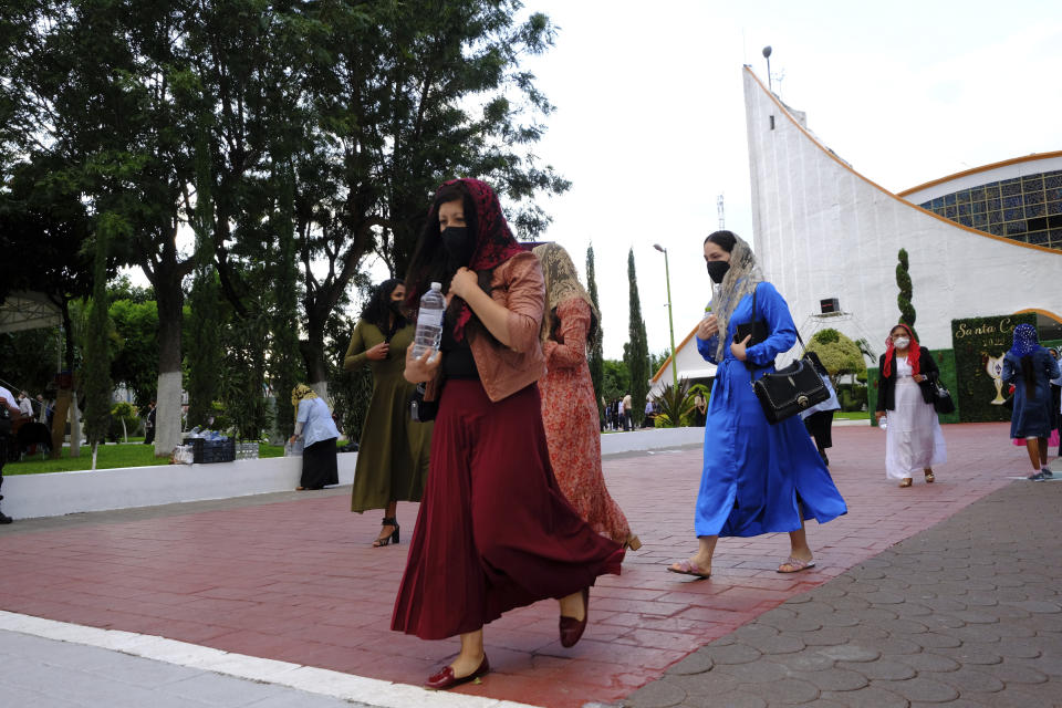 La Luz del Mundo or the Light of the World church members exit a service in the Bethel neighborhood of Guadalajara, Mexico, Saturday, Aug. 13, 2022. Female church members wear dresses and skirts that are not form-fitting, eschew makeup and earrings and wear their hair long. The religion is ”very demanding,” said Arlene M. Sánchez-Walsh, a professor of religious studies at Azusa Pacific University. “It is not sufficient to say ‘I have converted’ or “I have baptized’” she said. “You have to follow certain steps to prove your loyalty.” (AP Photo/Refugio Ruiz)