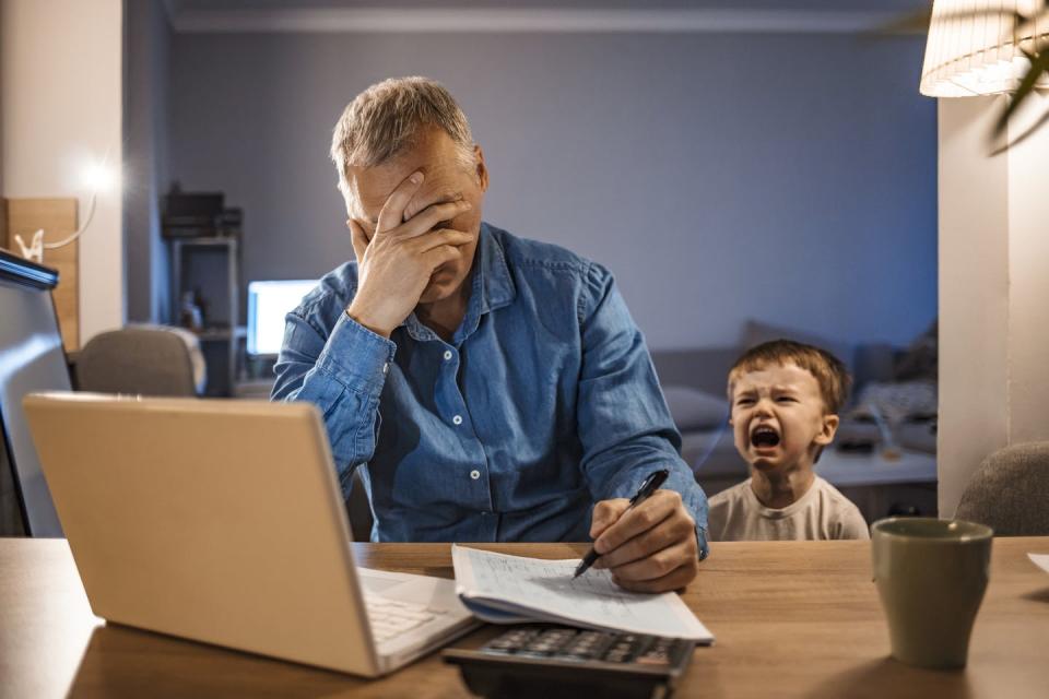 <span class="caption">Children will model the behavior of parents after watching and listening to them.</span> <span class="attribution"><a class="link " href="https://www.gettyimages.com/detail/photo/stressed-man-with-his-two-years-old-son-working-royalty-free-image/1219402896?adppopup=true" rel="nofollow noopener" target="_blank" data-ylk="slk:Getty Images / ljubaphoto;elm:context_link;itc:0;sec:content-canvas">Getty Images / ljubaphoto</a></span>