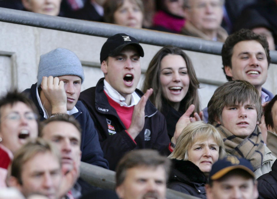 Kate spends time with William and his brother, Prince Harry, while cheering on England at a February 2007 rugby championship match.