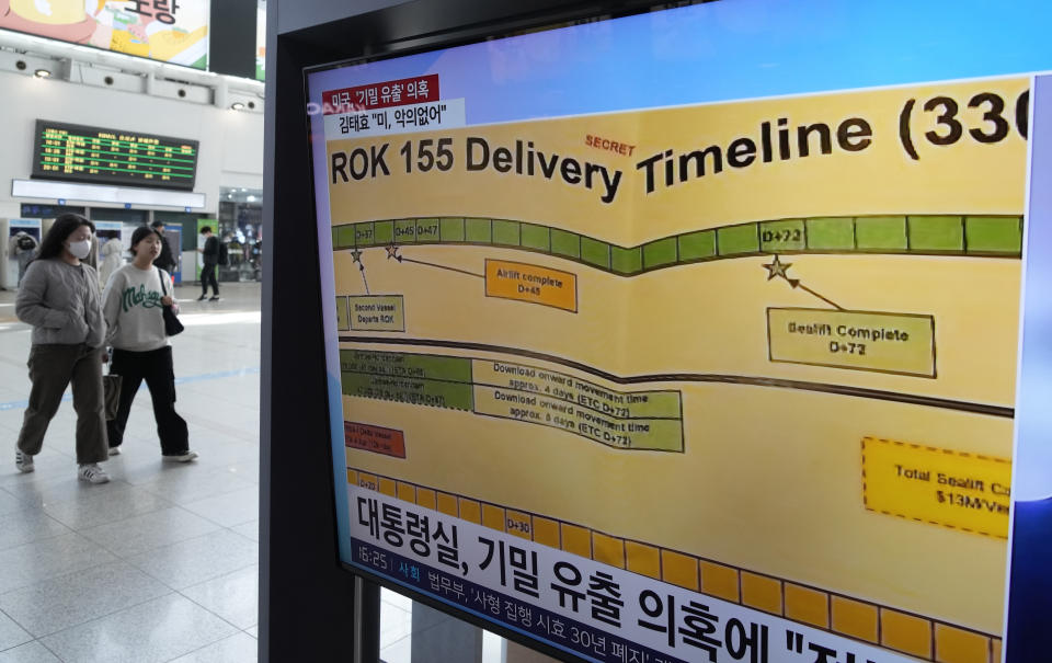 A TV screen shows a news program reporting on the leaked Pentagon documents at the Seoul Railway Station in Seoul, South Korea, Wednesday, April 12, 2023. (AP Photo/Ahn Young-joon)