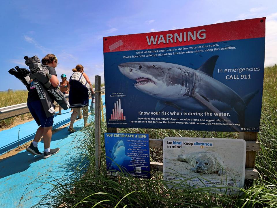 Warning signs by entrance to Nauset Town Beach at Cape Cod.