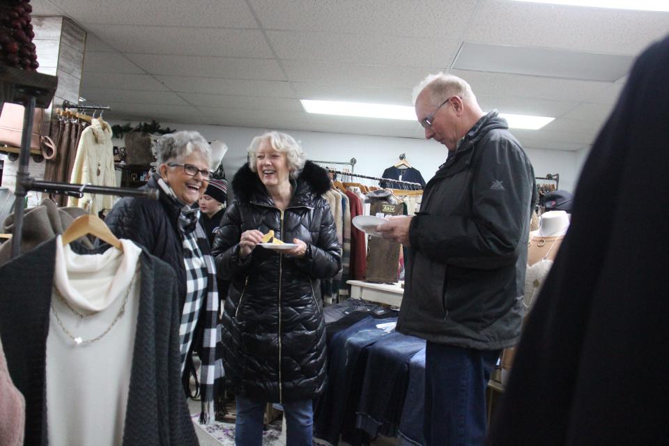 Attendees chat at Azalea Lane Boutique during the Sip and Sample event  as part of the Hometown Holiday Celebration on Friday, Dec. 2, 2022, in Adel.