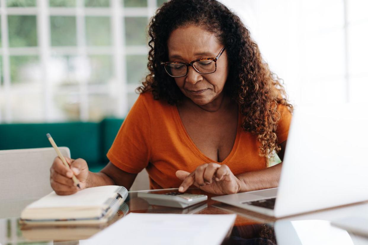 woman calculating her retirement annuity