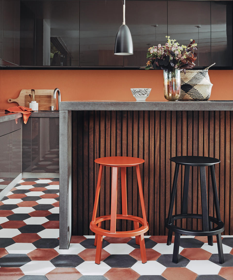 <p> Fashion forward folk should think outside the box with their kitchen floor tile ideas and plump for tessellating shaped tiles. Swap four sides for six with on-trend hexagonal tiles, which work for floors in all sizes, from large stone slabs to small, mosaic-like ceramics.&#xA0; </p> <p> You can opt for subtle tonal variations to create a sense of movement in the floor, or get funky with a contrasting color scheme like in this burnt orange, black and white kitchen.&#xA0; </p>