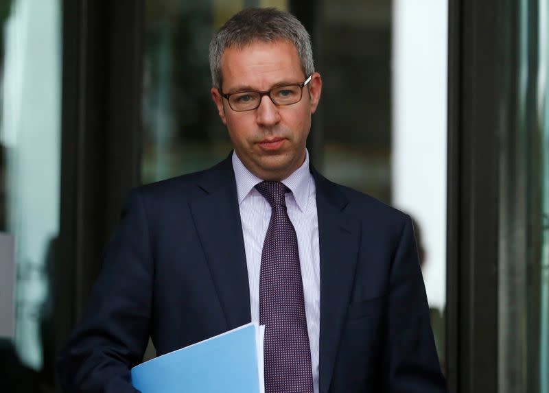 FILE PHOTO: AstraZeneca's head of innovative medicines Mene Pangalos leaves after appearing at a parliamentary business and enterprise committee hearing at Portcullis House in London