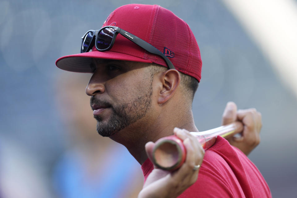 St. Louis Cardinals manager Oliver Marmol watches players warm up for a baseball game against the Colorado Rockies on Wednesday, Aug. 10, 2022, in Denver. (AP Photo/David Zalubowski)