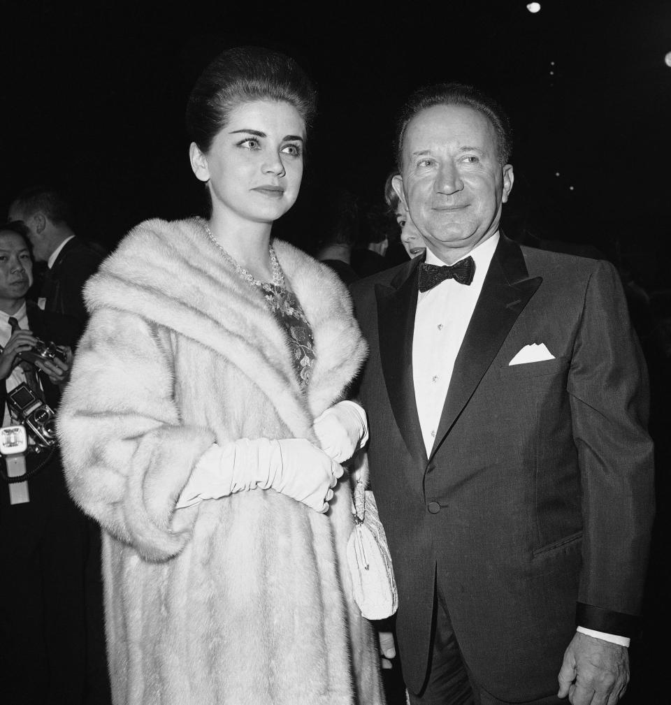 FILE - In this Dec. 21, 1962 file photo, actress Dolores Hart, left, escorted by banker and investor Serge Semenenko, arrives for the premiere of Lawrence of Arabia, in Hollywood, Calif. Hart, whose luminous blue eyes entranced Elvis Presley in his first on-screen movie kiss, is now a cloistered nun and praying for a Christmas miracle. She walked away from Hollywood stardom in 1963 to become a nun in rural Bethlehem, Conn. Now she finds herself back in the spotlight, but this time it's all about serving the King of Kings, not smooching the King of Rock and Roll. The former brass factory that houses Mother Dolores and about 40 other nuns cloistered at the Abbey of Regina Laudis in Bethlehem, Conn., needs millions of dollars in renovations to meet fire and safety codes, add an elevator and make handicap accessibility upgrades. (AP Photo, File)