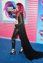 <p>Yes, she’s wearing a cape. And rocking hot pink hair. (Photo: Getty Images) </p>