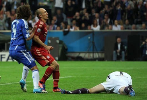 Chelsea's Czech goalkeeper Petr Cech (R) stops a penalty from Bayern Munich's Dutch midfielder Arjen Robben (2nd L) during the Champions League final at the Alliance Arena in Munich on May 19. Chelsea beat Bayern Munich 4-3 on penalties after the game finished 1-1 after extra-time