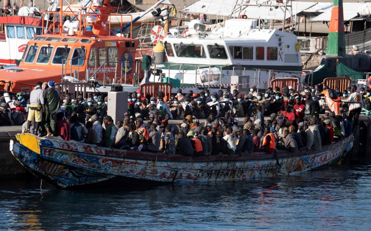 Some of the migrants arrive at Los Cristianos' port after being rescued by Spanish Salvamento Maritimo - Miguel Barreto/EPA-EFE/Shutterstock /Shutterstock 