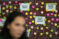 Notes from students expressing support and sharing coping strategies paper a wall, as members of the Miami Arts Studio mental health club raise awareness on World Mental Health Day, Tuesday, Oct. 10, 2023, at Miami Arts Studio, a public 6th-12th grade magnet school, in Miami. (AP Photo/Rebecca Blackwell)