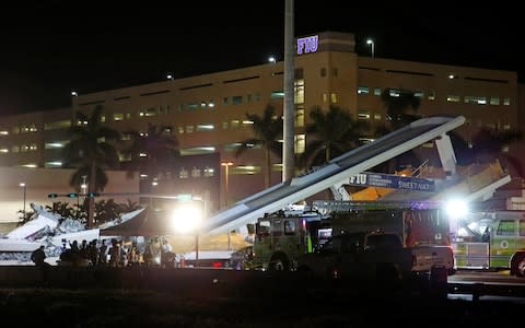 The collapse bridge in the shadow of Florida International University - Credit: JOE SKIPPER /Reuters