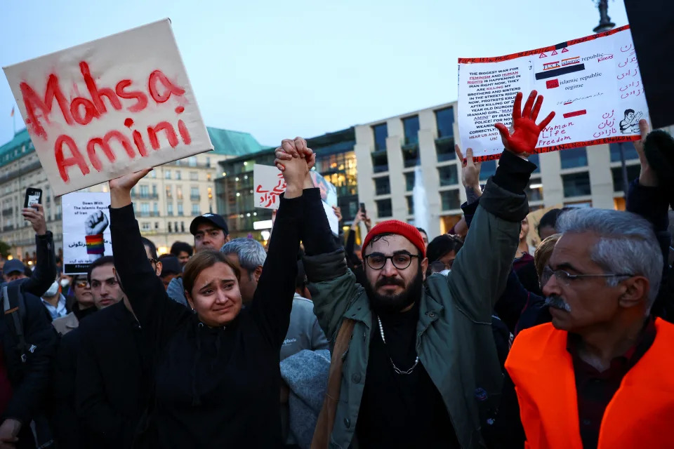 <p>SENSITIVE MATERIAL. THIS IMAGE MAY OFFEND OR DISTURB People take part in a protest following the death of Mahsa Amini in Iran, in front of the Brandenburg Gate in Berlin, Germany, September 23, 2022. REUTERS/Christian Mang</p> 