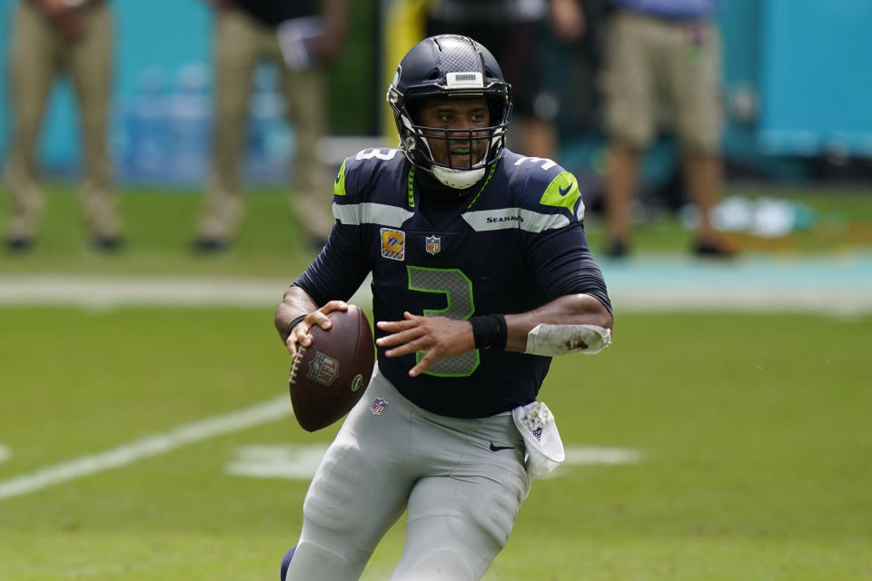 Seattle Seahawks quarterback Russell Wilson (3) looks to pass the ball during the first half of an NFL football game against the Miami Dolphins, Sunday, Oct. 4, 2020 in Miami Gardens, Fla. (AP Photo/Wilfredo Lee)