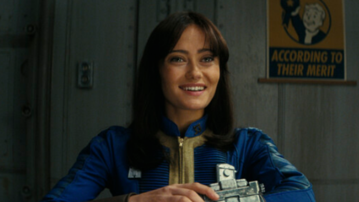  Lucy smiling while using her pip boy. 