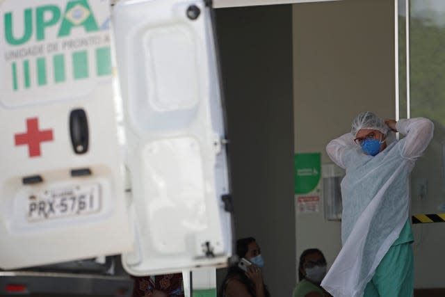 A health worker prepares to receive a Covid-19 patient in Brazil