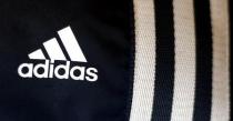 The logo of Adidas is pictured in a store in Munich March 4, 2014. REUTERS/Michael Dalder