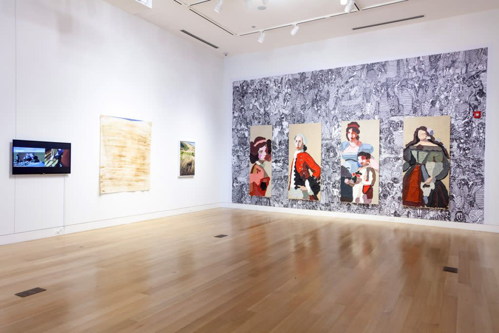 The interior of DePaul Art Museum with painting hung on the wall. 