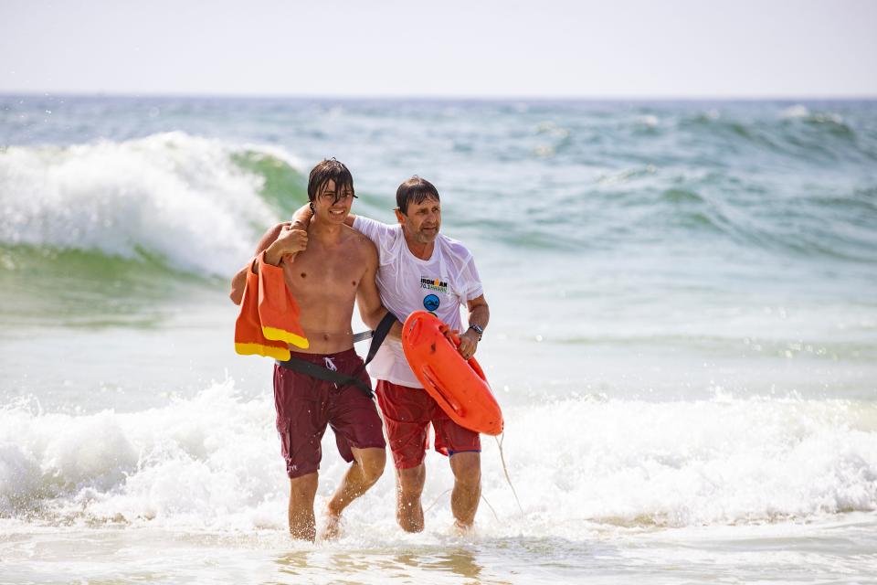 Lifeguard trainees Banyan Turk and Scott Lyman come to shore after Turk practiced rescuing Lyman in the Gulf. The PCB Beach Safety Division ran lifeguard applicants through rescue training near City Pier Wednesday, March 17, 2021. 