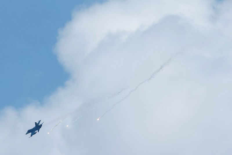 FILE PHOTO: A Taiwan domestically-built Indigenous Defense Fighter (IDF) releases flares during annual Han Kuang military drill simulating the China's People's Liberation Army (PLA) invading the island, in Pingtung county, southern Taiwan