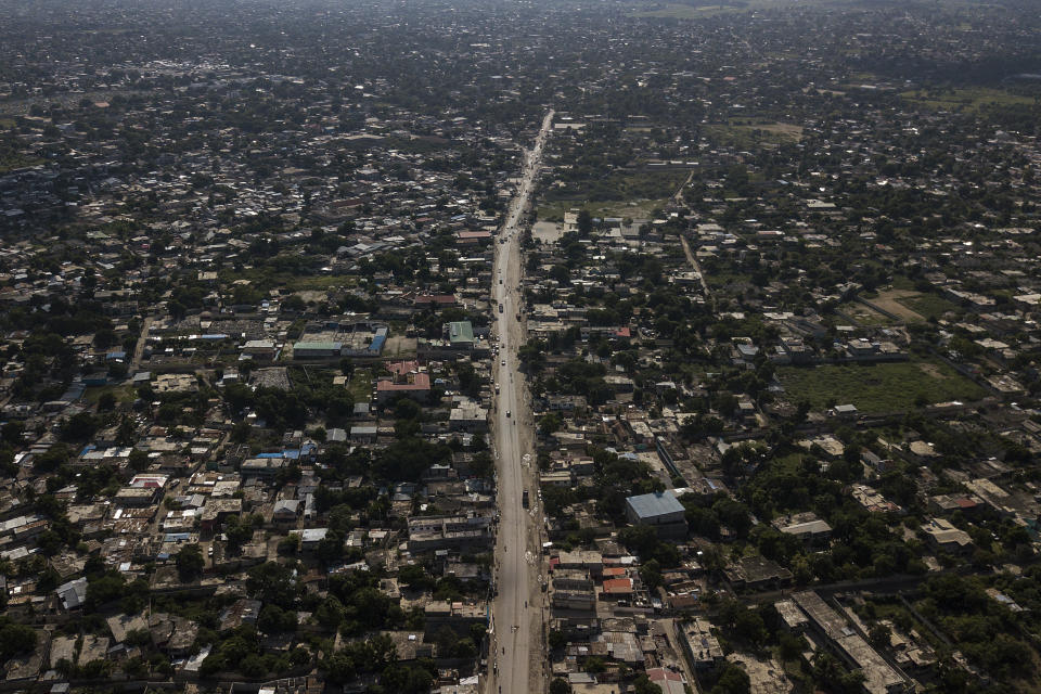 International Route Number 8, which connects Haiti with the Dominican Republic, is empty of large trucks as a result of a transportation strike in Croix-des-Bouquets, Haiti, Wednesday, Oct. 20, 2021. Workers angry about the nation’s lack of security are on strike in protest after 17 members of a U.S.-based missionary group were abducted by a violent gang on this road in Croix-des-Bouquets. (AP Photo/Matias Delacroix)