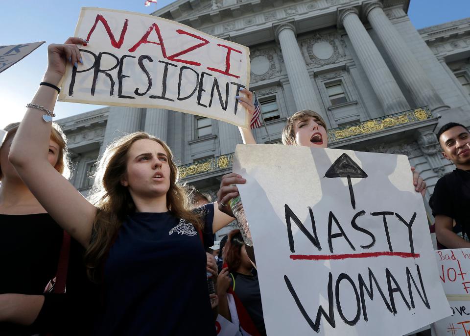 Mission High School students Hope Robertson, left, and Cat Larson yell as they protest with other high school students in opposition of Donald Trump's presidential election victory in front of City Hall in San Francisco, Thursday, Nov. 10, 2016. (AP Photo/Jeff Chiu) ORG XMIT: CAJC116

Protestors in San Francisco on Nov. 10, 2016.