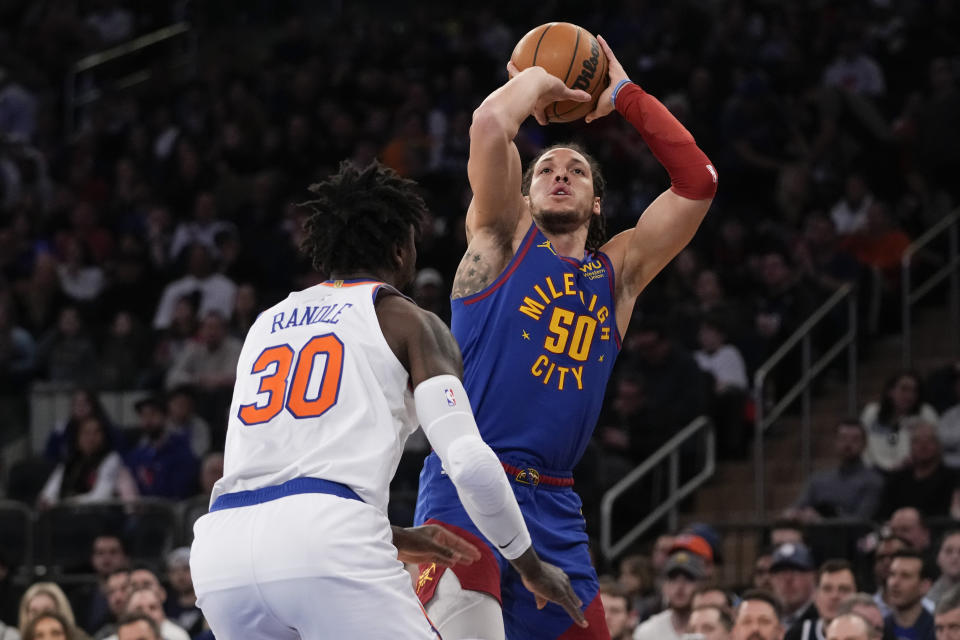 Denver Nuggets forward Aaron Gordon (50) shoots over New York Knicks forward Julius Randle (30) during the first half of an NBA basketball game, Saturday, March 18, 2023, at Madison Square Garden in New York. (AP Photo/Mary Altaffer)