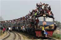 Tongi / Northern Border of Dhaka / Bangladesh. <br><br>During the Muslim Congregation, local residents arrived at and left the Congregation by train. They climbed to top of the train and squeezed themselves into the train using every little space they could find. <br><br>Camera: Nikon D3S <br><br>Yeow Kwang Yeo, Singapore <br><br>Winner, Best Single Image in the Exotic portfolio category
