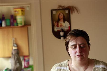 Catherine Droogan poses for a photograph in the kitchen of her house in the Northern Ireland town of Omagh February 27, 2014. REUTERS/Cathal McNaughton