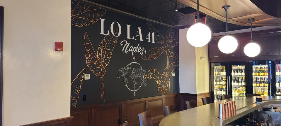LoLa 41's barroom’s signature artwork is a gigantic chalkboard with shimmery metallic images of a globe, palms and Birds of Paradise plants created by Boston-based artist Joan Aylward, better known as ChalkBOS.