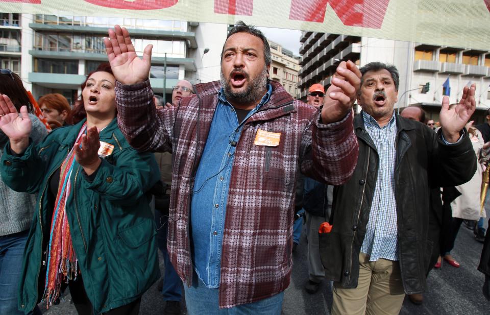 Municipal employees chant slogans during a demonstration organized by their union in Athens, on Tuesday, Nov. 20, 2012. About 2,000 people took part in the protest, against government plans to place 2,000 civil servants on notice ahead of reassignment or potential dismissal. Greece faces a tense wait Tuesday for vital bailout money as finance ministers from the 17 European Union countries that use the euro try to reach an agreement on how to put the country's economic recovery back on the right track. (AP Photo/Thanassis Stavrakis)
