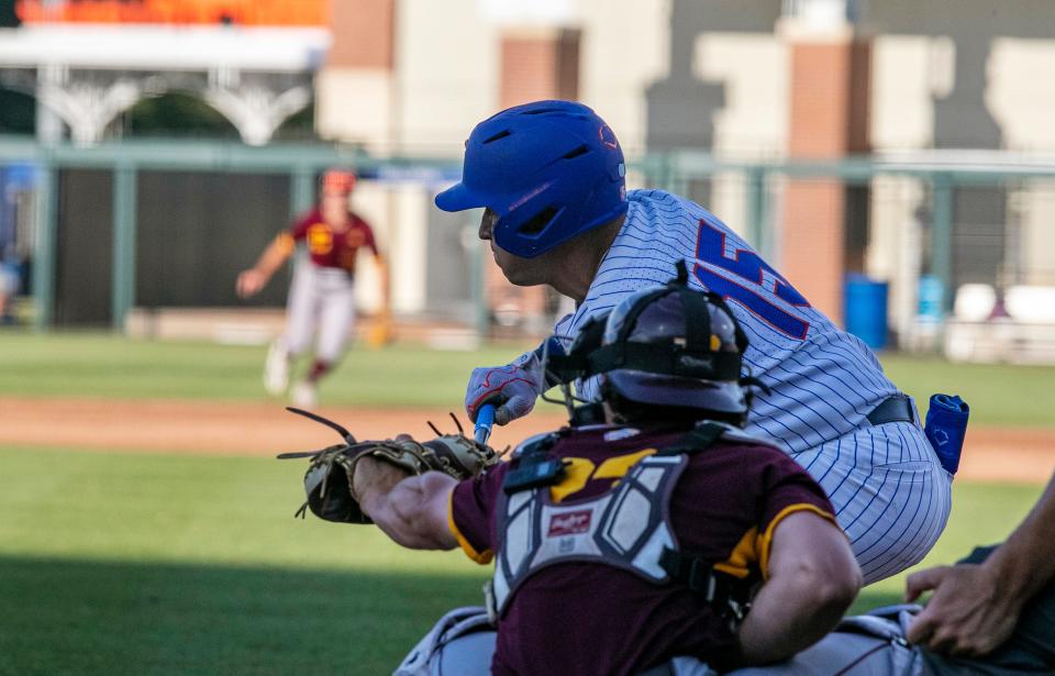 Florida's BT Riopelle (15) bunts against Central Michigan during an NCAA baseball tournament regional game Friday, June 3, 2022, in Gainesville, Fla.