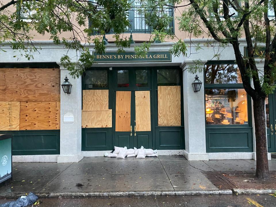 A boarded-up restaurant in Charleston on Friday (Richard Hall/The Independent)