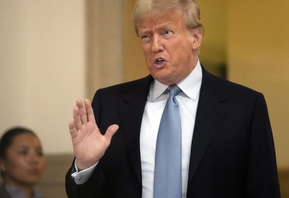 Former President Donald Trump leaves the courtroom during the lunch break of his civil business fraud trial at New York Supreme Court, Wednesday, Oct. 18, 2023, in New York. (AP Photo/Seth Wenig)