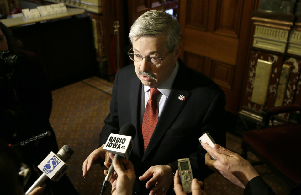FILE - In this April 9, 2014 file photo, Iowa Gov. Terry Branstad speaks to reporters outside his formal office at the Statehouse in Des Moines, Iowa. Branstad is fending off multiple mini-scandals and has become a political target in a mid-term campaign that was supposed to be about the Democratic president’s problems, not his. Republicans worry that the turmoil will roil the political waters as they attempt to win a U.S. Senate seat and control of the state Senate. (AP Photo/Charlie Neibergall)