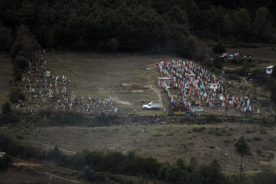 Workers prepare a grave in the cemetery where environmental activist Homero Gomez Gonzalez was to be buried the following day, in Ocampo, Michoacan state, Mexico, Thursday, Jan. 30, 2020. Relatives of the anti-logging activist who fought to protect the winter habitat of monarch butterflies don't know whether he was murdered or died accidentally, but they say they do know one thing for sure: something bad is happening to rights and environmental activists in Mexico, and people are afraid. (AP Photo/Rebecca Blackwell)