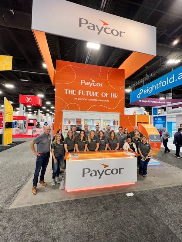 Paycor workers at the Paycor Booth at HR Tech 2022.