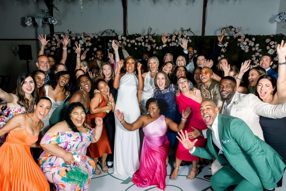 PHOTO: Robin Roberts and Amber Laign are surrounded by the production teams from “Good Morning America” and ABC News at their wedding celebration. (Kellie Walsh/4 Eyes Photography)