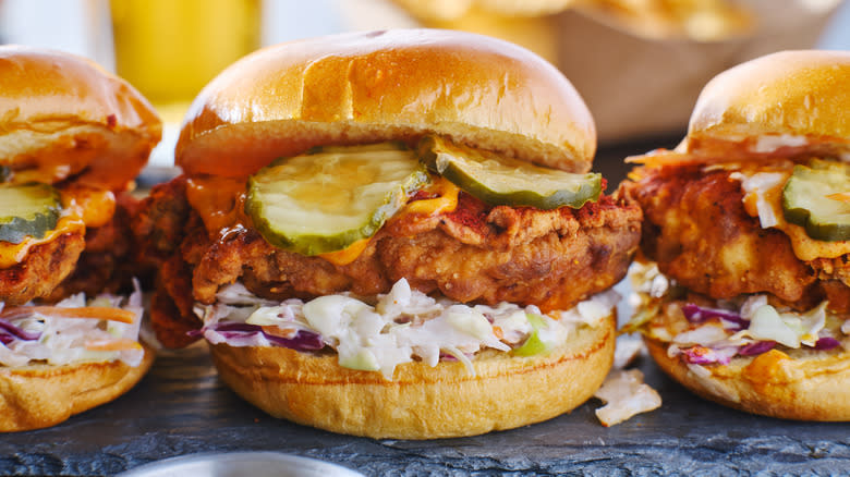 fried chicken sandwiches with pickles and sauce