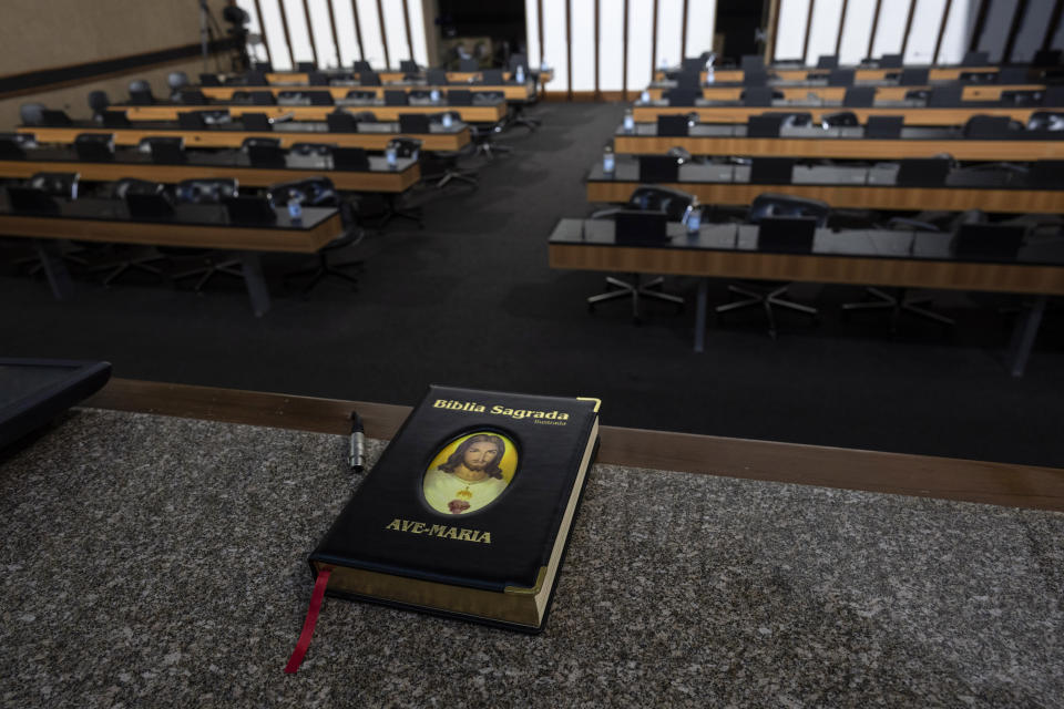 A Bible sits on a desk inside the chambers of the Bahia state legislature, in Salvador, Brazil, Thursday, Sept. 15, 2022. Influential politicians and evangelical pastors are warning their followers, on Facebook and in pulpits, that Brazil's former President Luiz Inacio Lula da Silva, who is running for president and leads in all the polls in the upcoming Oct. 2 general election, would persecute Christians. (AP Photo/Rodrigo Abd)