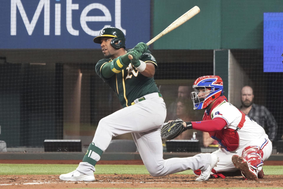 Oakland Athletics shortstop Elvis Andrus singles in the fifth inning against the Texas Rangers in a baseball game Tuesday, June 22, 2021, in Arlington, Texas. (AP Photo/Louis DeLuca)