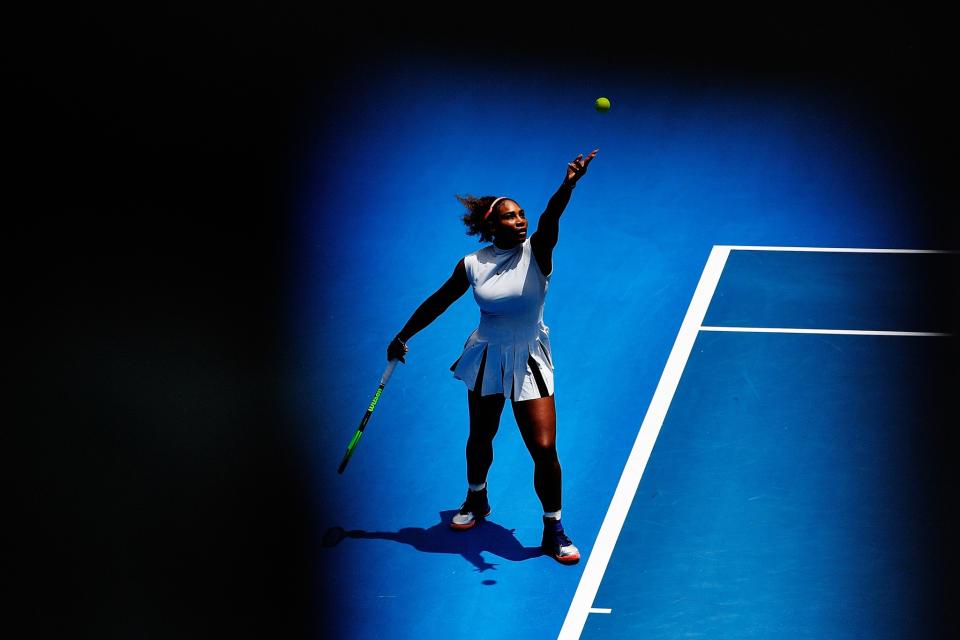 Serena Williams serves