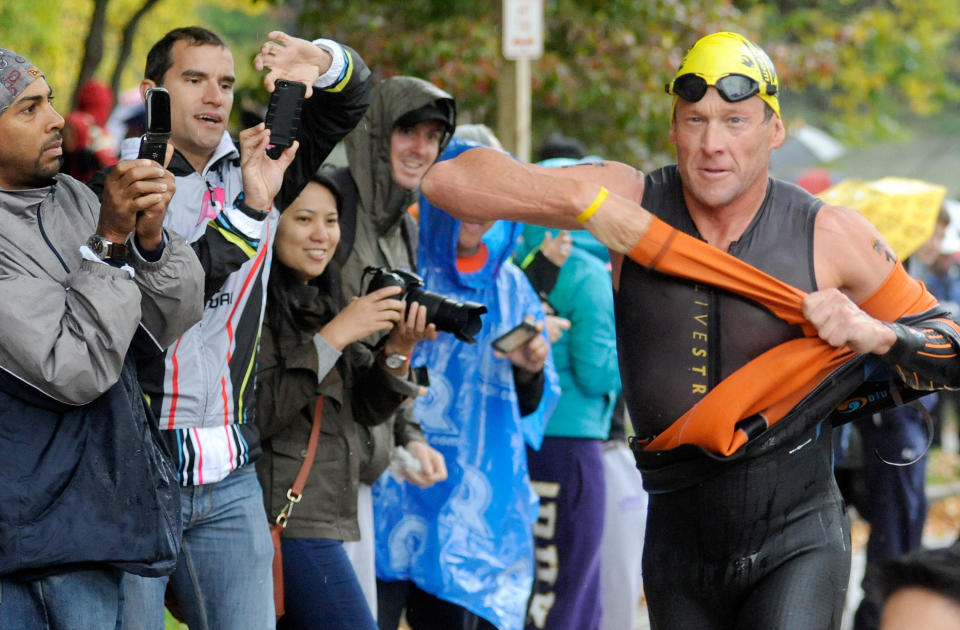 Lance Armstrong competes in the Rev3 Half Full Triathalon Sunday, Oct. 7, 2012 in Ellicott City, Md. Armstrong joined other cancer survivors in the event which raised funds for the Ulman Cancer Fund for Young Adults. 